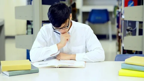 Young student study hard in library. Stock Footage 85652404