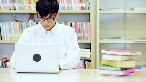 Young student study hard in library. Stock Footage 85652604