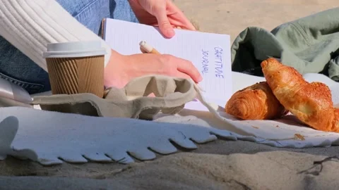 Young student study with notebook on beach next to sea ocean view. Writing Stock Footage 219596740