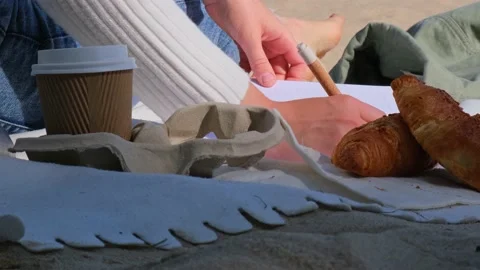 Young student study with notebook on beach next to sea ocean view. Writing Stock Footage 223957050