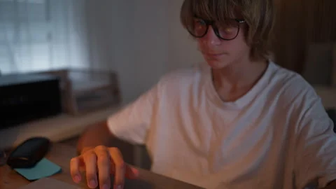 Young student studying and developing new skills with a laptop and notebook.. Stock Footage 341977509