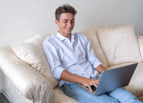 Young student studying on laptop computer - young people remote lessons with Stock Photos