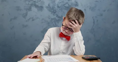 Young student takes notes on pages supporting head with hand Stock-Footage 304363478