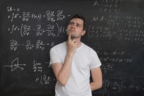 Young student is thinking and solving mathematical problem Stockfoto's