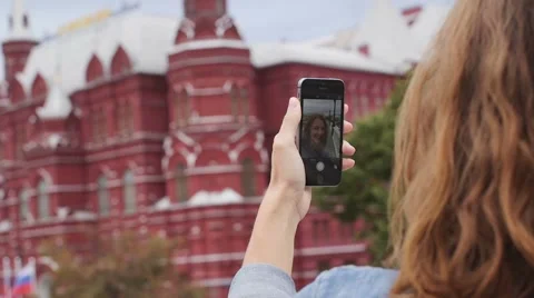 Young student tourist taking self portrait using smartphone camera. Stock Footage 68402887