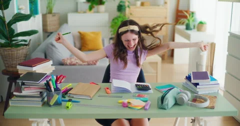 A Young Student Uses a Calculator While Doing Math Homework Stock Footage 277086757
