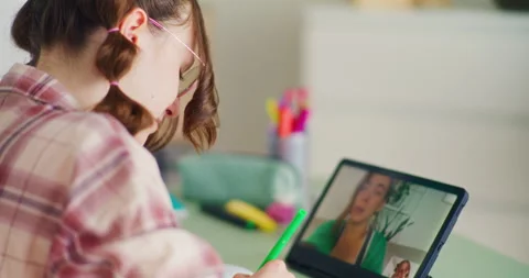 Young Student Using a Digital Tablet During Remote Online Classes Stock Footage 277136256