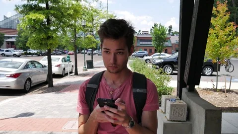 Young student using a smart phone 스톡 동영상 76507692