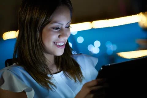 Young Student Using Tablet PC Indoor At Night Stock Photos