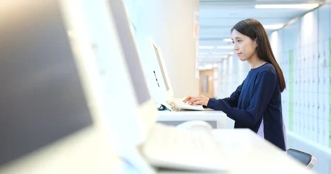 Young Student working on computer in university Stock Footage 83612811