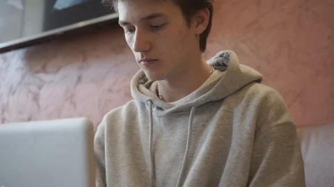 Young student working on a laptop Stock Footage 127748720