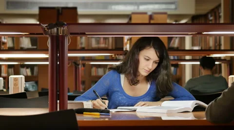 Young student works at the library Stock Footage 45519681
