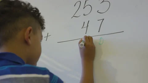 Young Student Writes Answer To Math Problem 库存影片 208712425