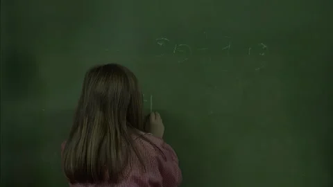 Young Student Writing on Classroom Chalkboard Stock Footage 330491981