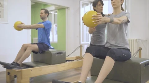 Young students and instructor working the upper body with a wunda chair Stock Footage 126976392