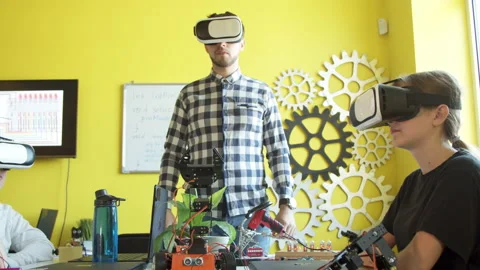 Young students and teacher with robot in classroom Stock Footage 140759430
