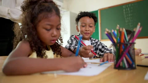 Young students are learning to draw and sketch with colored pencils Stock Footage 340828606