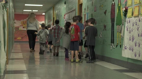 Young students being lead down the hall (2 of 7) Stock Footage 50418008