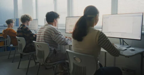 Young Students in Bright Classroom Learning Software Development Stock Footage 318523887