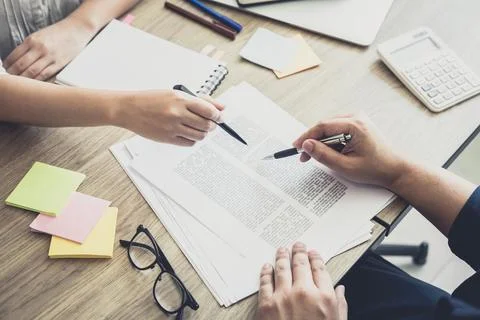 Young students campus or classmates with helps friend studying for a test a.. Stock Photos