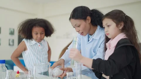 Young students girls in a lab setting Stock Footage 340448640