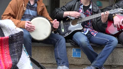 Young students group play with guitars and drum and sing. 4K Stock Footage 56747847