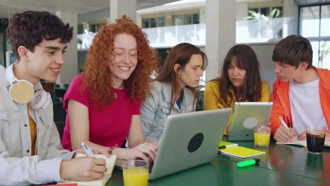 Young students group working together with laptop computers at college library Stock Footage 244048034