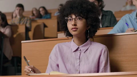 Young students learn at lecture room. Group of people study in university or pup Stock Footage 199483828