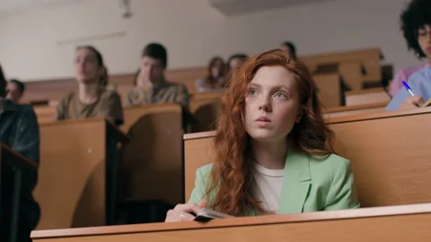 Young students learn at lecture room. Group of people study in university or pup Stock Footage 199483919