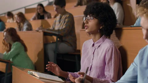 Young students learn at lecture room. Group of people study in university or pup Stock Footage 199483963