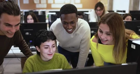 Young students learning together inside computer classroom at school Stock Footage 168622715