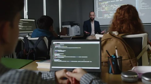 Young Students Listening to Teacher at Programming Class Stock Footage 278124608