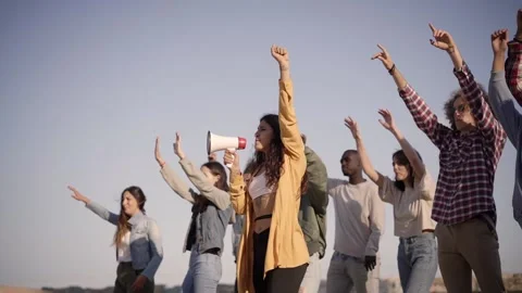 Young Students Participating in A Demonstration Shouting on Megaphone. Young Stock Footage 234087933