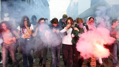 Young students protesters march with burning smoke flares Vídeo Stock 98406845
