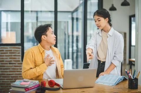 Young students quarrel when their work fails and goals are not met. , commu.. Stock Photos