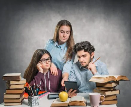 Young students reading an ebook Stock Photos