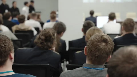 Young students sit at a training conference. Stock Footage 241664038