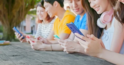 Young students use smartphone Stock Footage 127015724