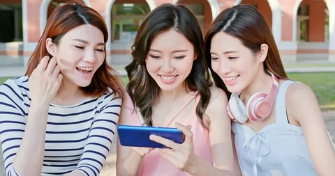 Young students use smartphone Stock Footage 128161277