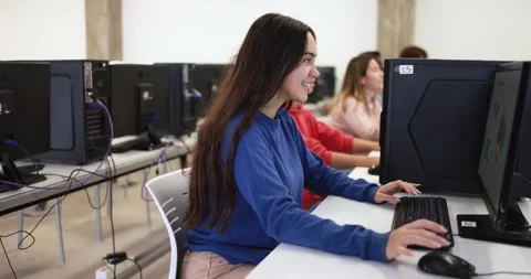 Young students using computer inside college classroom Видео 168622858