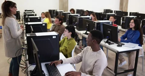 Young students using computers at school class Stockbeeldmateriaal 168622581
