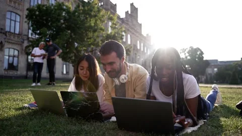 Young students using laptops during study outdoors Stock-Footage 163280408