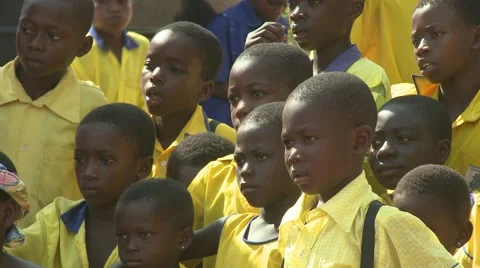 YOUNG STUDENTS WATCH PERFORMANCE AT SCHOOL CEREMONY Stock Footage 59865589