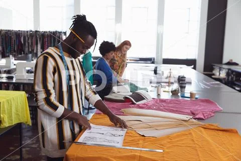 Young students working on projects at a fashion college Stock Photos
