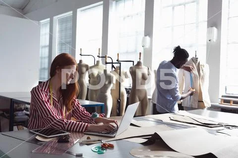 Young students working on projects at a fashion college Stock Photos