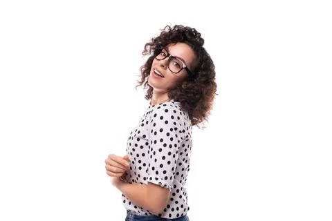 Young stylish caucasian woman with curly perm hair looks happy and confident Stock Photos