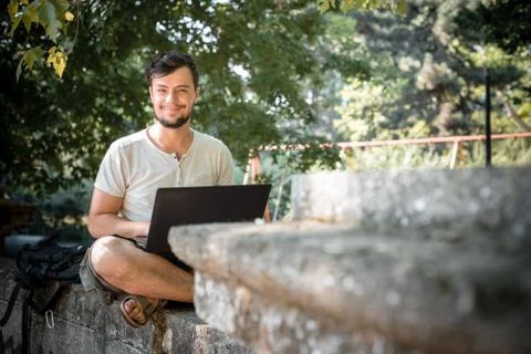 Young stylish man using notebook Stock Photos