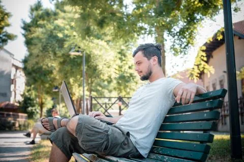 Young stylish man using notebook Stock Photos