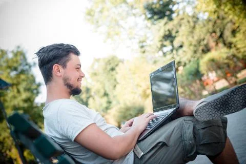 Young stylish man using notebook Stock Photos