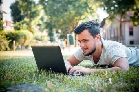 Young stylish man using notebook Stock Photos